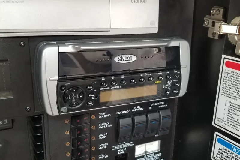 Slide: The Image of Clarion stereo system on 2004 Sea Ray 300 Sundancer control panel. - 20