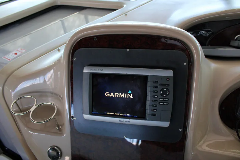 Slide: The Image of Garmin GPS system on 2003 Sea Ray 380 Sundancer boat dashboard. - 17