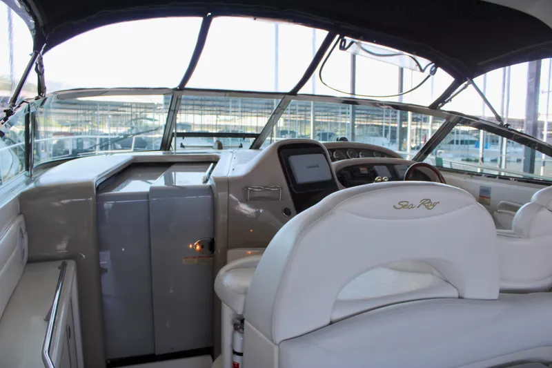 Slide: The Image of Interior view of 2003 Sea Ray 380 Sundancer yacht cockpit with helm and seating. - 22