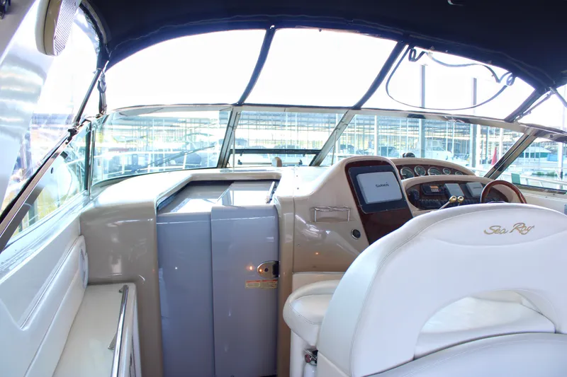 Slide: The Image of Interior cockpit of 2003 Sea Ray 380 Sundancer yacht with steering and navigation equipment. - 23