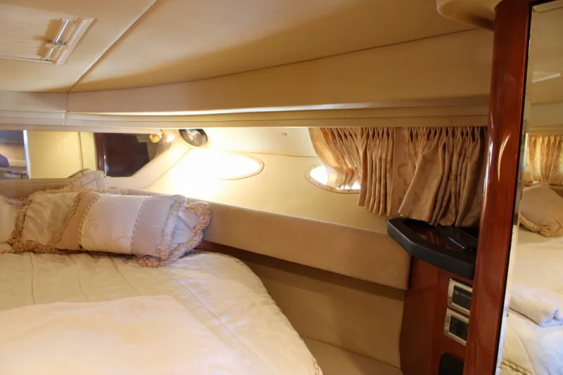 Slide: The Image of Luxurious cabin interior of 2003 Sea Ray 380 Sundancer yacht with plush bedding. - 27
