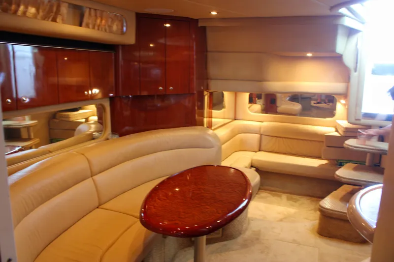 Slide: The Image of Luxurious interior of a 2003 Sea Ray 380 Sundancer yacht with elegant seating and wood finishes. - 28