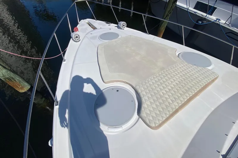 Slide: The Image of 2002 Cruisers Yachts 3572 Express deck with sun pad. - 11