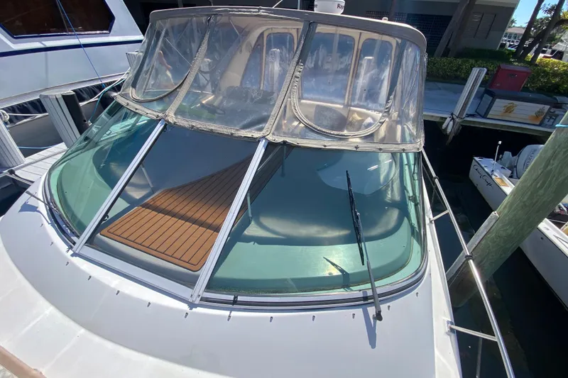 Slide: The Image of 2002 Cruisers Yachts 3572 Express with clear canopy and sleek windshield design. - 15