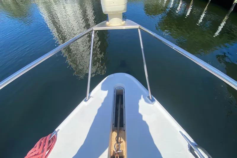 Slide: The Image of Bow view of 2002 Cruisers Yachts 3572 Express on calm water. - 16