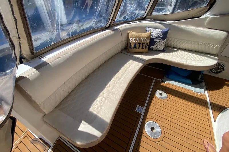 Slide: The Image of Luxurious interior of 2002 Cruisers Yachts 3572 Express with plush seating and decorative pillows. - 19