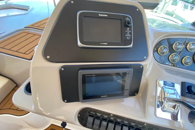 Slide: The Image of Dashboard of 2002 Cruisers Yachts 3572 Express with navigation equipment and controls. - 23