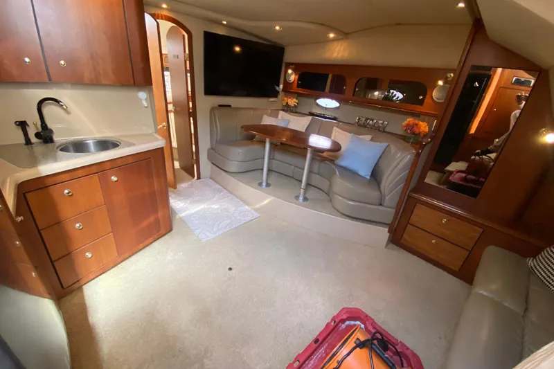 Slide: The Image of Luxurious interior of 2002 Cruisers Yachts 3572 Express with kitchenette and seating area. - 25