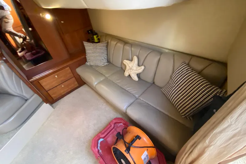 Slide: The Image of Interior of 2002 Cruisers Yachts 3572 Express with leather sofa and decorative pillows. - 26