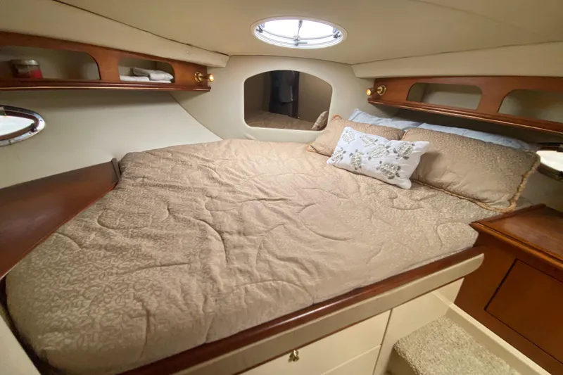Slide: The Image of Luxurious cabin interior of 2002 Cruisers Yachts 3572 Express with cozy bedding. - 30