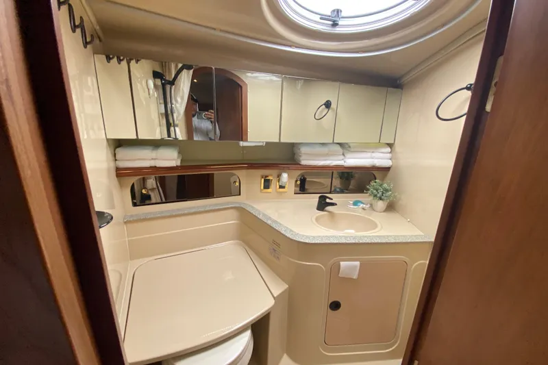 Slide: The Image of Luxurious bathroom in 2002 Cruisers Yachts 3572 Express with modern amenities and elegant design. - 33