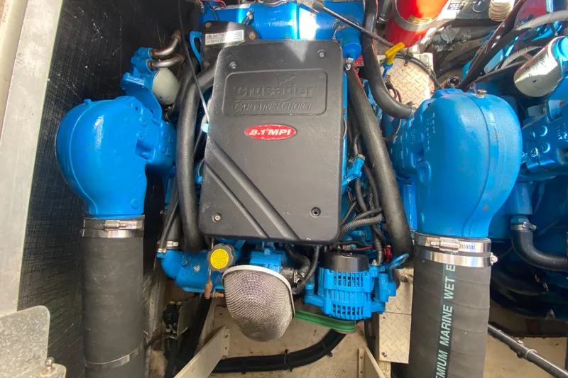 Slide: The Image of Engine compartment of a 2002 Cruisers Yachts 3572 Express, featuring a Crusader 8.1 MPI engine. - 35