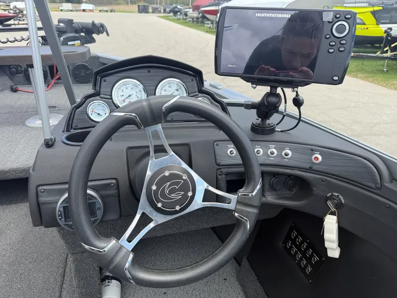 Slide: The Image of Interior view of 2021 Crestliner 1750 Super Hawk boat with steering and electronics. - 12