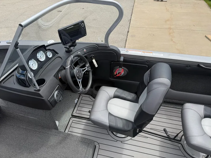 Slide: The Image of Interior of a 2021 Crestliner 1750 Super Hawk boat with steering console. - 15