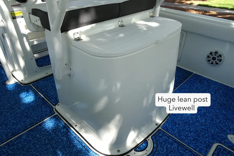 Slide: The Image of 2021 Clearwater 2200 Center Console with large lean post livewell on blue deck. - 13