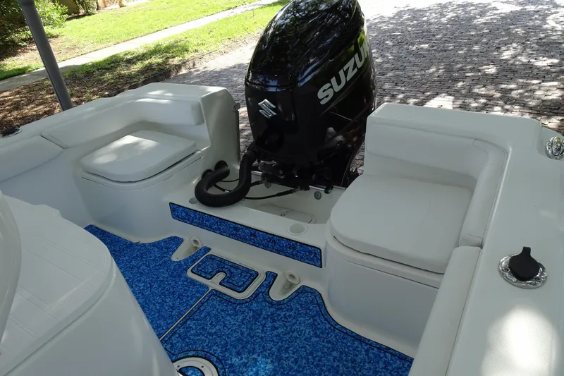 Slide: The Image of 2021 Clearwater 2200 Center Console boat interior with Suzuki outboard motor. - 14