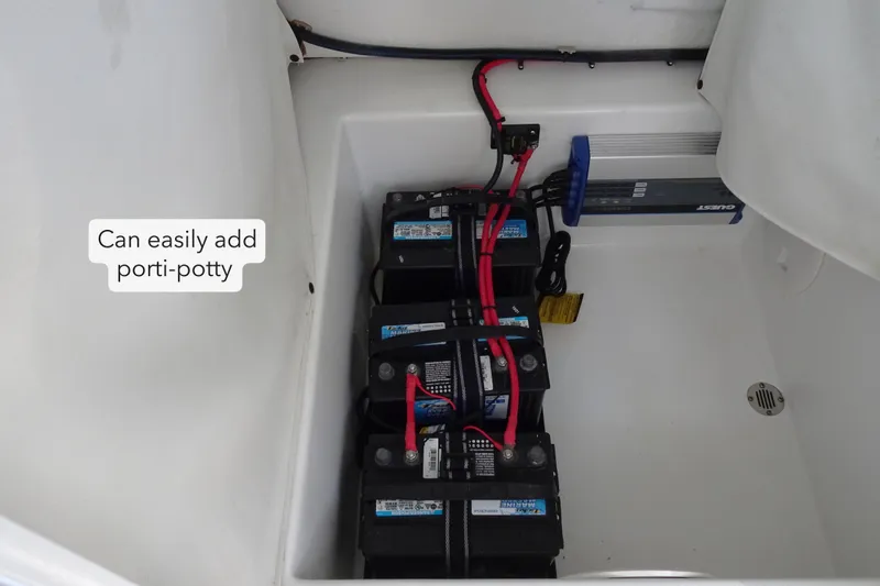 Slide: The Image of 2021 Clearwater 2200 Center Console boat battery compartment with space for portable toilet. - 15