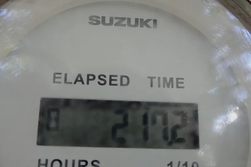 Slide: The Image of Suzuki elapsed time gauge showing 217.2 hours on Clearwater 2200 Center Console, 2021 model. - 18