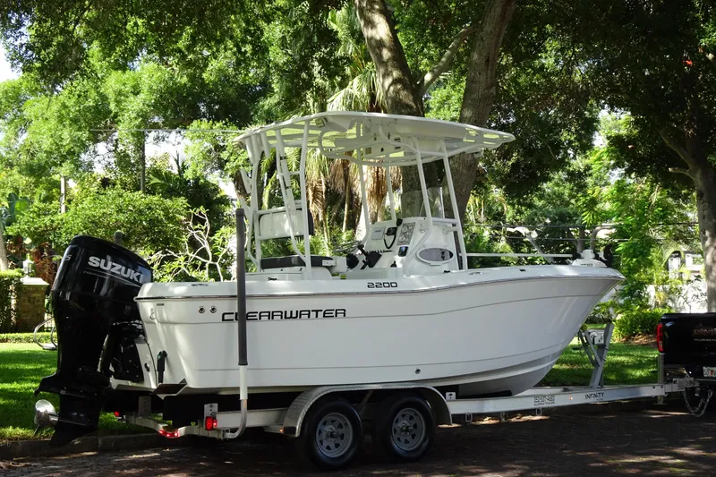 Slide: The Image of 2021 Clearwater 2200 Center Console boat on trailer, parked outdoors. - 21