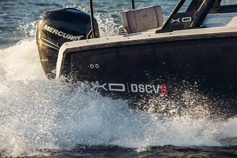 Slide: The Image of 2027 XO DSCVR 9 T-TOP boat cruising on water with powerful Mercury engine. - 4