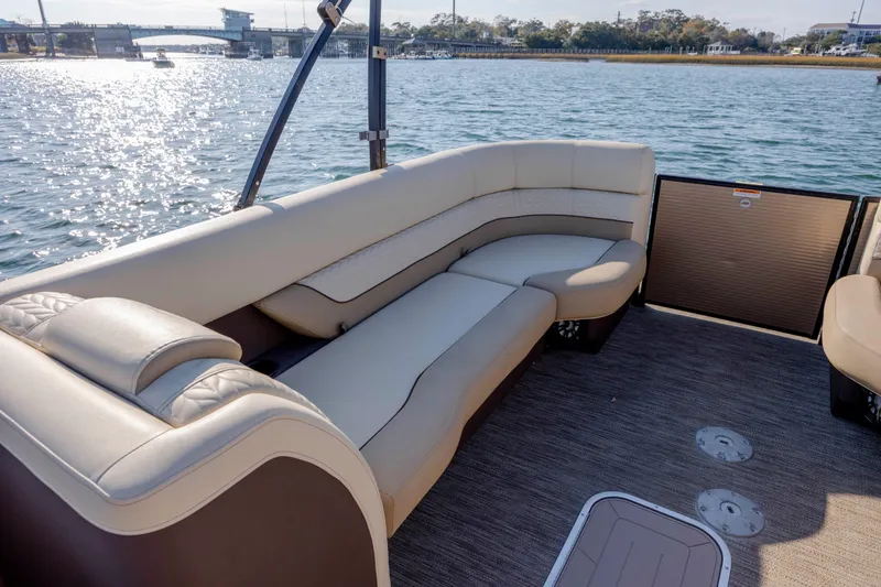 Slide: The Image of Luxurious seating on 2022 Godfrey Monaco 255 SFL pontoon boat, with scenic water view. - 12