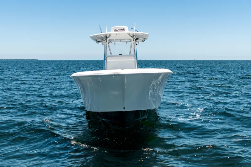 Slide: The Image of 2022 Contender 35 ST boat on open ocean under clear blue sky. - 10