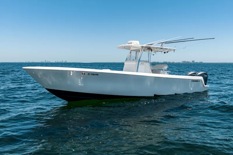 Slide: The Image of 2022 Contender 35 ST boat on open water, clear sky background. - 11