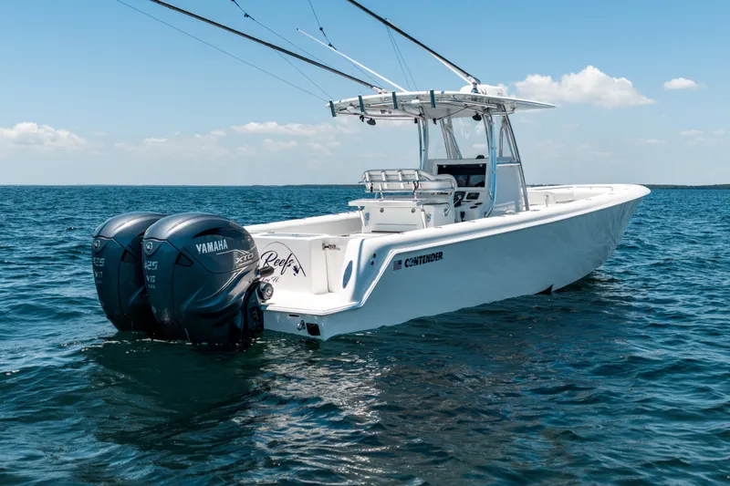 Slide: The Image of 2022 Contender 35 ST boat with dual Yamaha engines on open water. - 15