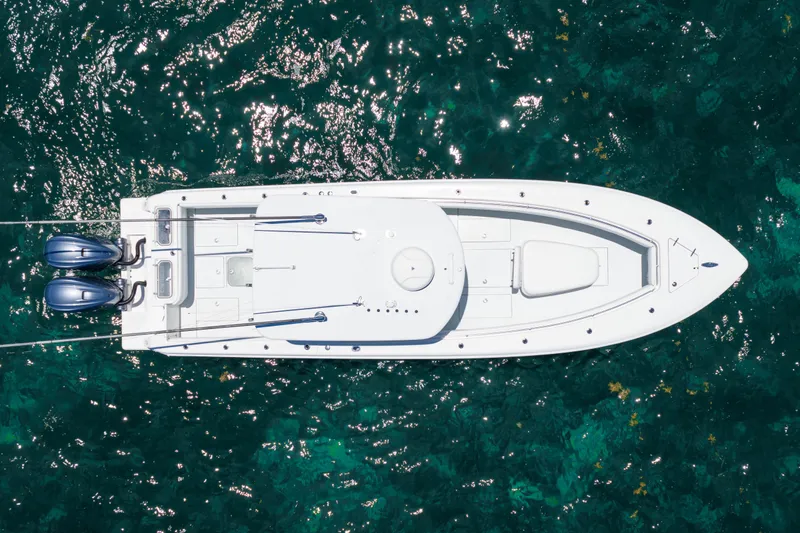 Slide: The Image of Aerial view of 2022 Contender 35 ST boat on clear ocean water. - 16