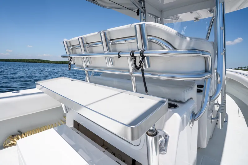 Slide: The Image of 2022 Contender 35 ST boat interior with sleek seating and stainless steel fixtures on open water. - 25