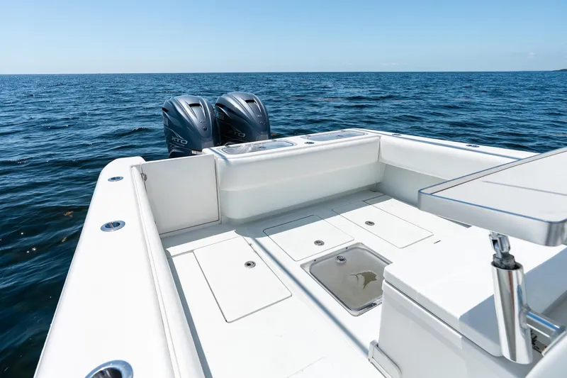 Slide: The Image of 2022 Contender 35 ST boat with dual outboard motors on open ocean. - 29