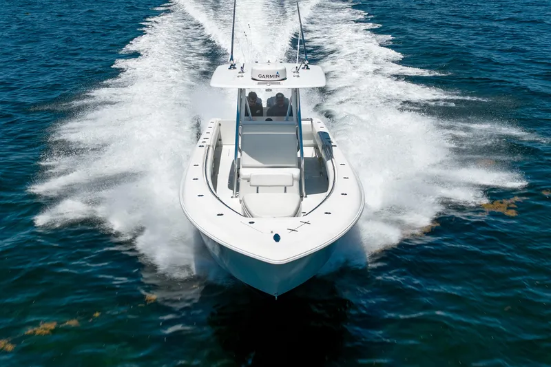 Slide: The Image of 2022 Contender 35 ST boat cruising on open water, creating a dynamic wake. - 3