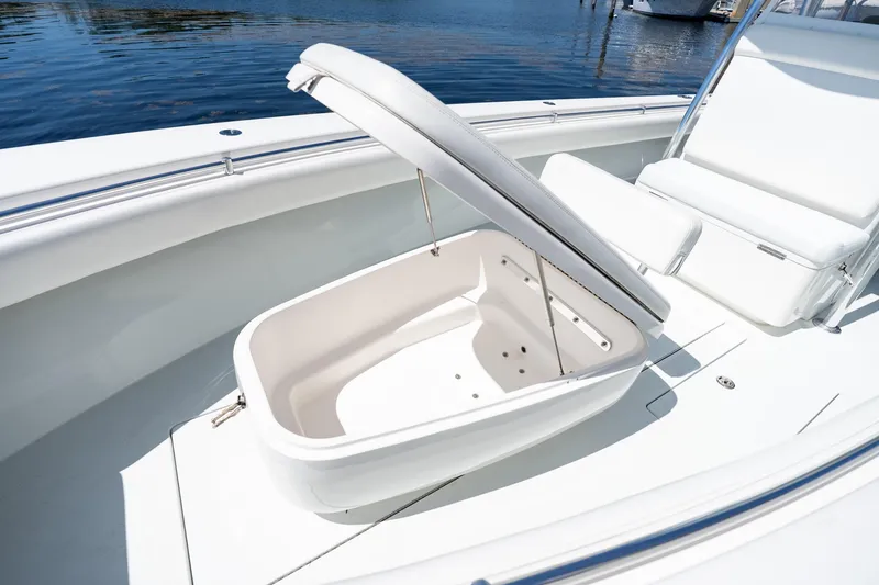 Slide: The Image of 2022 Contender 35 ST boat with open storage compartment on deck. - 35
