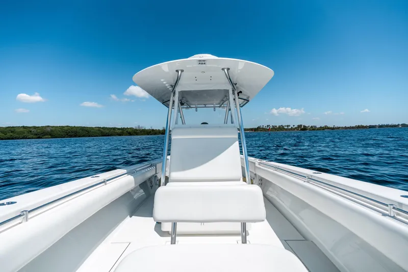 Slide: The Image of 2022 Contender 35 ST boat on open water under clear blue sky. - 36