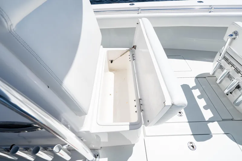 Slide: The Image of 2022 Contender 35 ST boat with open storage compartment on deck. - 37