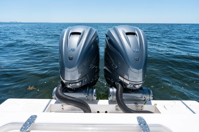 Slide: The Image of Twin Yamaha V8 outboard engines on a 2022 Contender 35 ST boat in open water. - 39