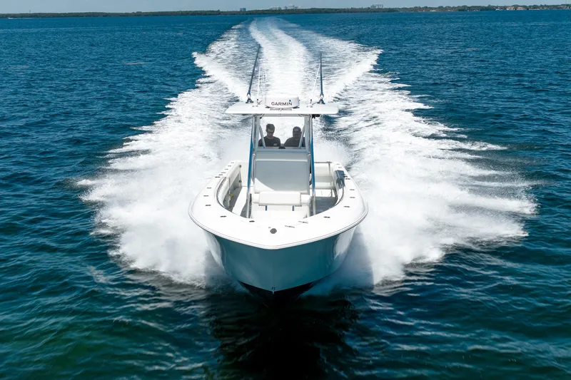 Slide: The Image of 2022 Contender 35 ST boat cruising on open water, creating a dynamic wake. - 4
