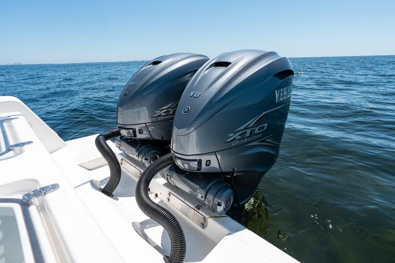 Slide: The Image of Twin Yamaha XTO Offshore engines on a 2022 Contender 35 ST boat in open water. - 40