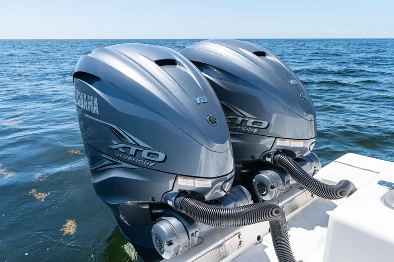 Slide: The Image of Twin Yamaha XTO Offshore V8 engines on a 2022 Contender 35 ST boat in open water. - 41