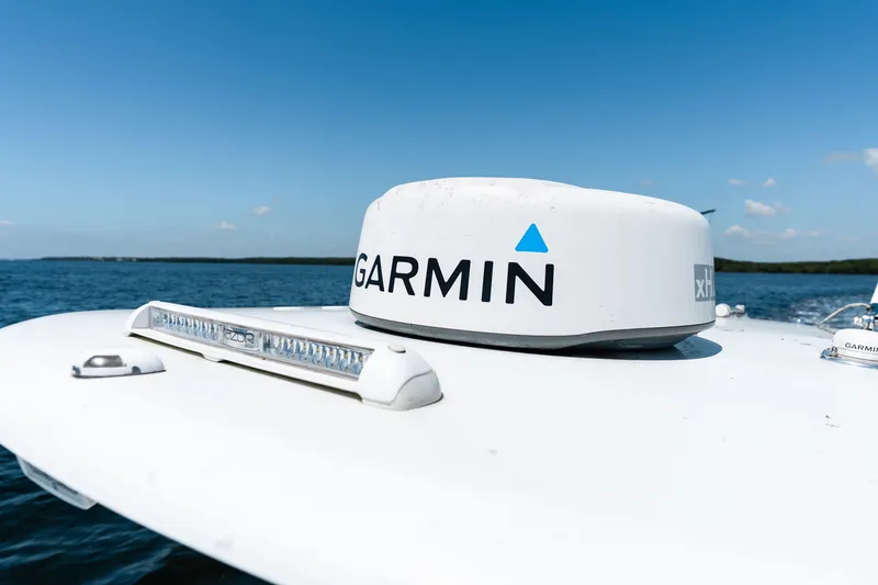 Slide: The Image of Garmin radar on 2022 Contender 35 ST boat under clear blue sky. - 44