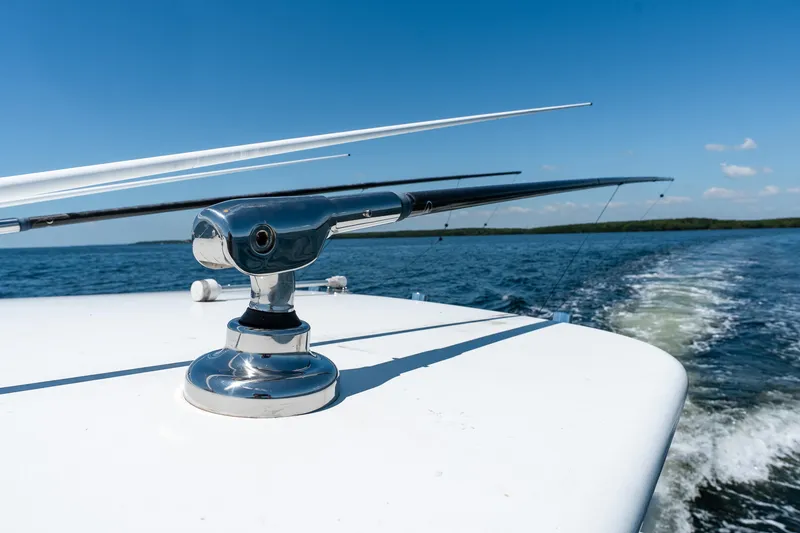 Slide: The Image of 2022 Contender 35 ST boat on water, featuring sleek chrome fittings. - 46