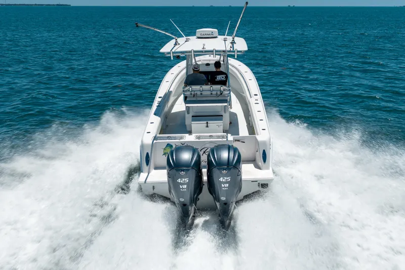 Slide: The Image of 2022 Contender 35 ST boat cruising on open water with twin 425 V8 engines. - 6