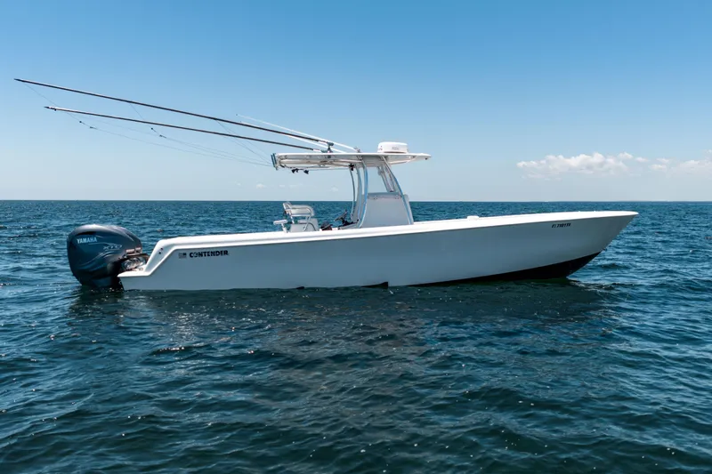 Slide: The Image of 2022 Contender 35 ST boat on open water with Yamaha engine. - 8