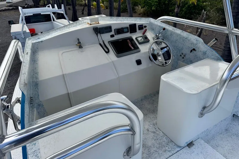Slide: The Image of 2008 Force Marine Force 21 boat cockpit with steering wheel and control panel. - 6