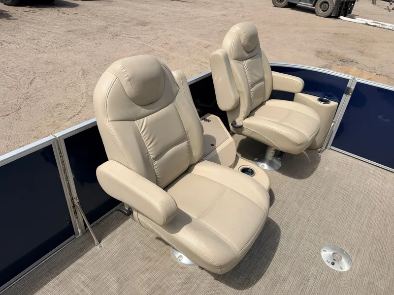 Slide: The Image of Two beige leather seats on a Sylvan Mirage 8524 LE boat. - 15