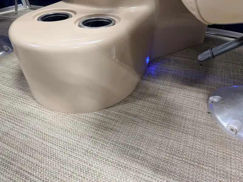 Slide: The Image of Interior of Sylvan Mirage 8524 LE boat, beige plastic with blue lighting. - 26