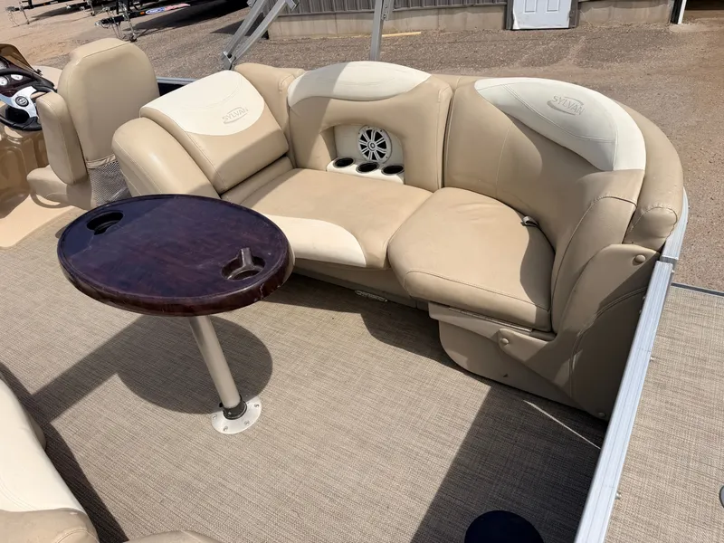 Slide: The Image of Sylvan Mirage 8524 LE pontoon boat with beige seating area and table, 2016 model. - 38