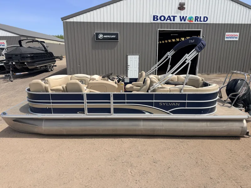 Slide: The Image of 2016 Sylvan Mirage pontoon boat in front of Boat World building. - 4