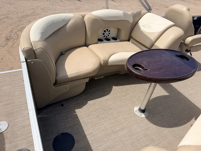 Slide: The Image of Interior of Sylvan Mirage 8524 LE pontoon boat, beige seats and table. - 40