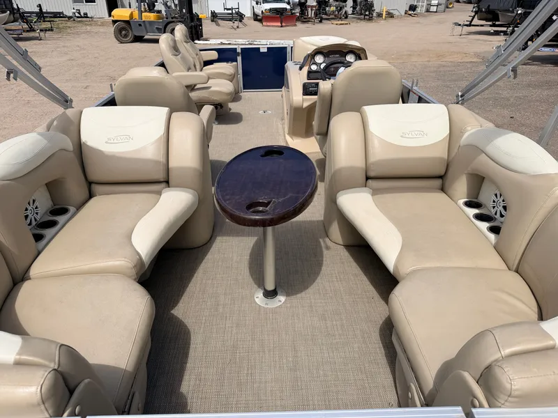Slide: The Image of 2016 Sylvan Mirage 8524 LE pontoon boat with beige seating. - 8